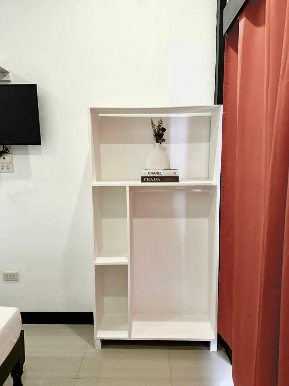 TV a/nebo společenská místnost v ubytování Mayad El Nido Inn