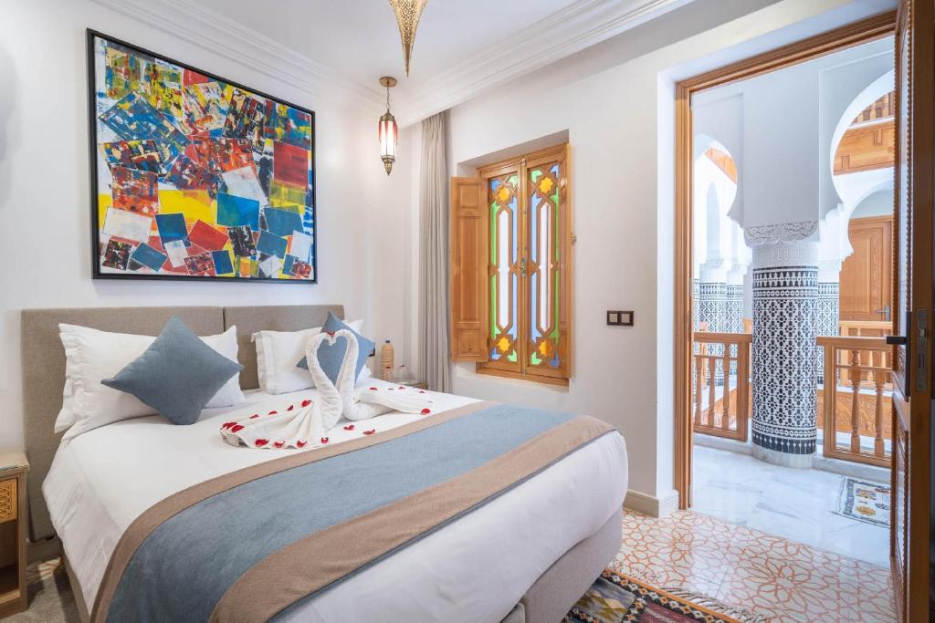 Postel nebo postele na pokoji v ubytování Riad Atlas Palace & SPA