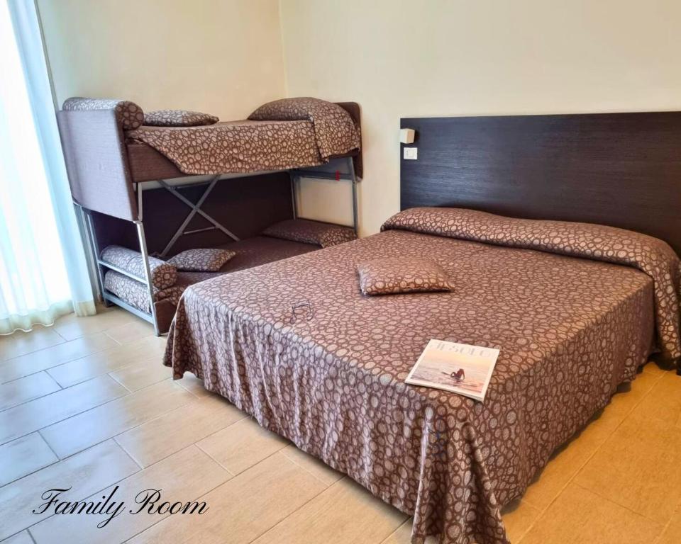 Łóżko lub łóżka w pokoju w obiekcie Hotel Morena