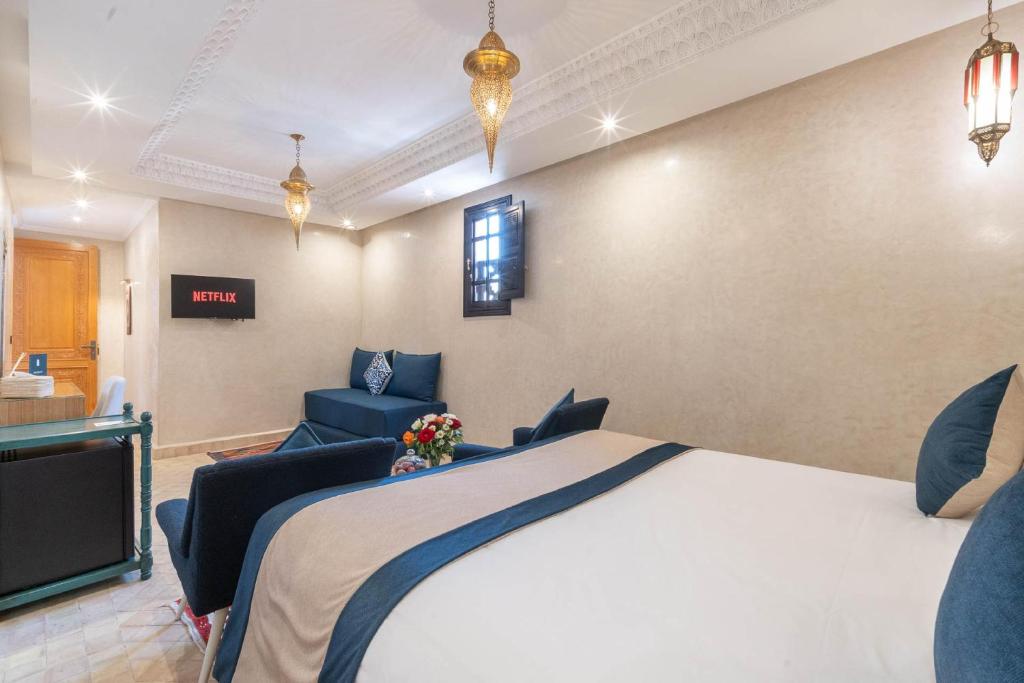 Postel nebo postele na pokoji v ubytování Riad Atlas Palace & SPA