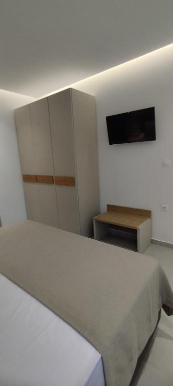 Postel nebo postele na pokoji v ubytování Studios Lainis