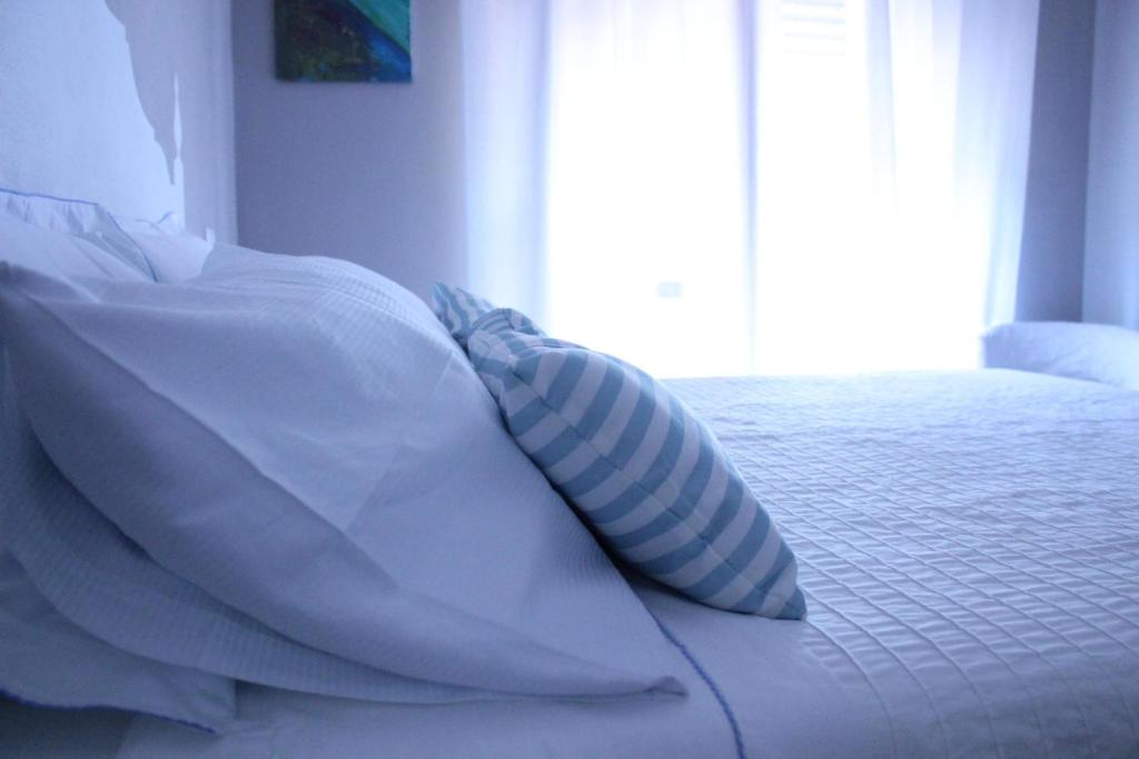 Posteľ alebo postele v izbe v ubytovaní B&B Nannalia