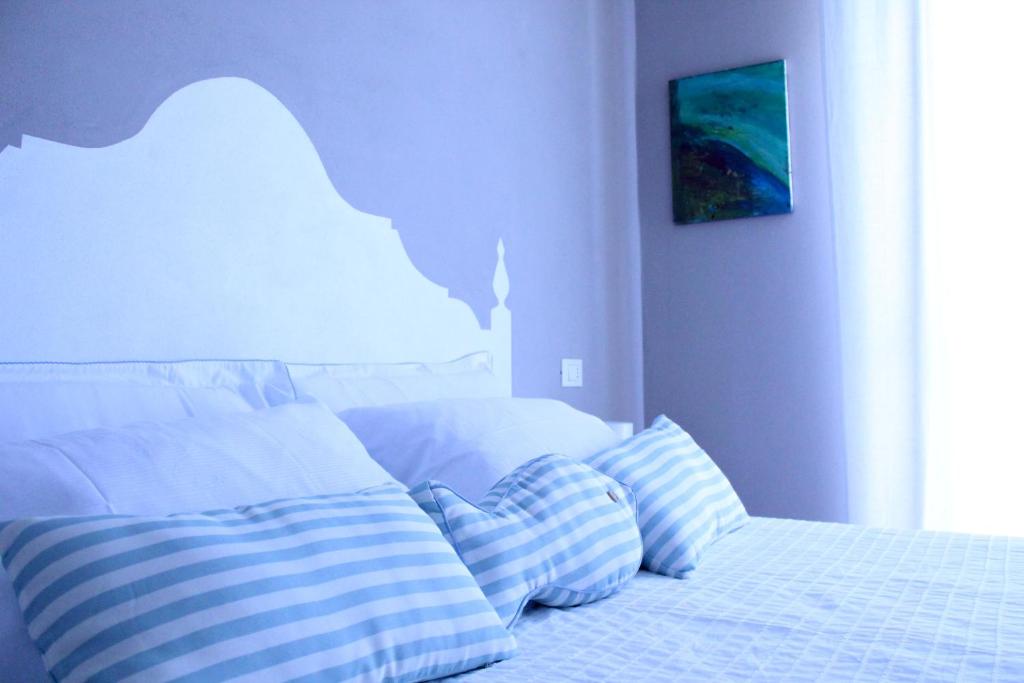 Posteľ alebo postele v izbe v ubytovaní B&B Nannalia