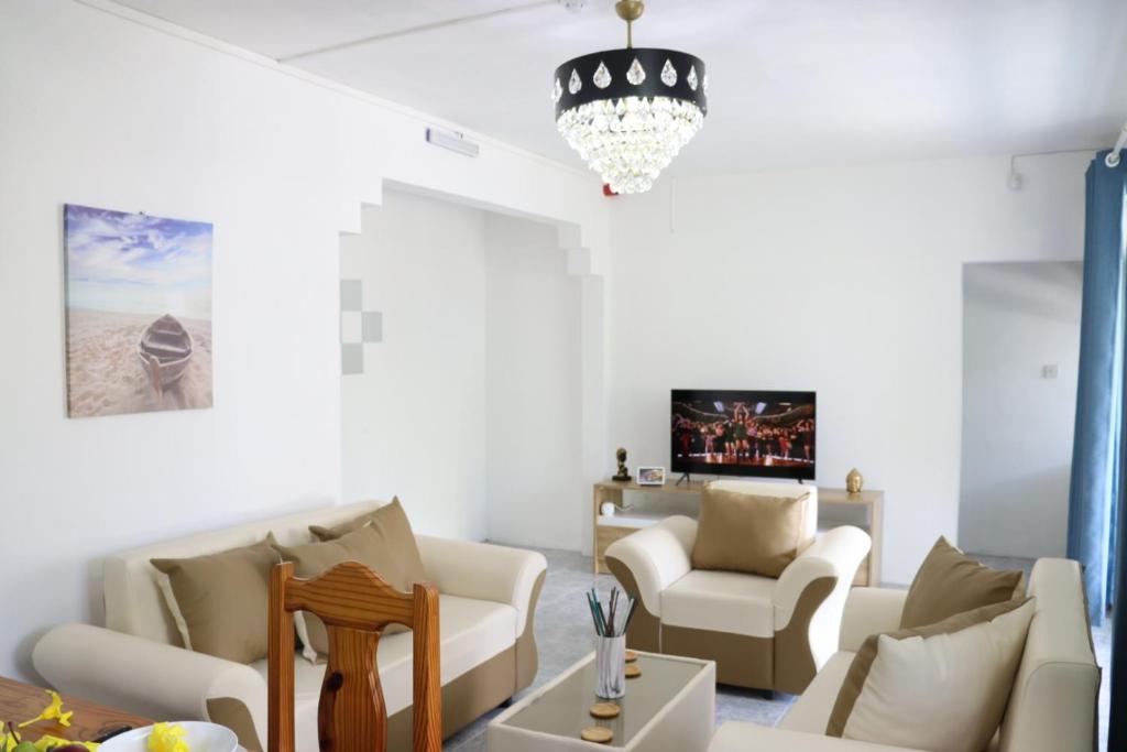 Svetainės erdvė apgyvendinimo įstaigoje Garden Suite