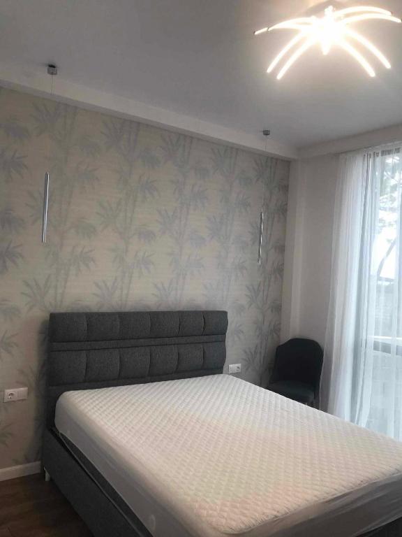 Postel nebo postele na pokoji v ubytování Sun Beach Hotel Grigoleti