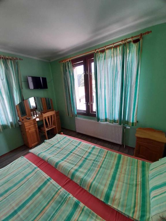 Postel nebo postele na pokoji v ubytování Guest House Lorian