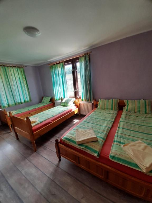 Postel nebo postele na pokoji v ubytování Guest House Lorian