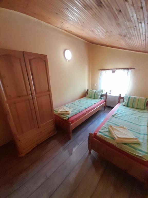 Postel nebo postele na pokoji v ubytování Guest House Lorian