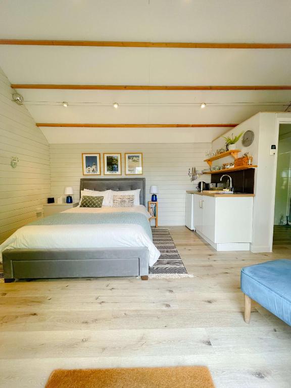 a bedroom with a large bed in a room at The cabin in Truro