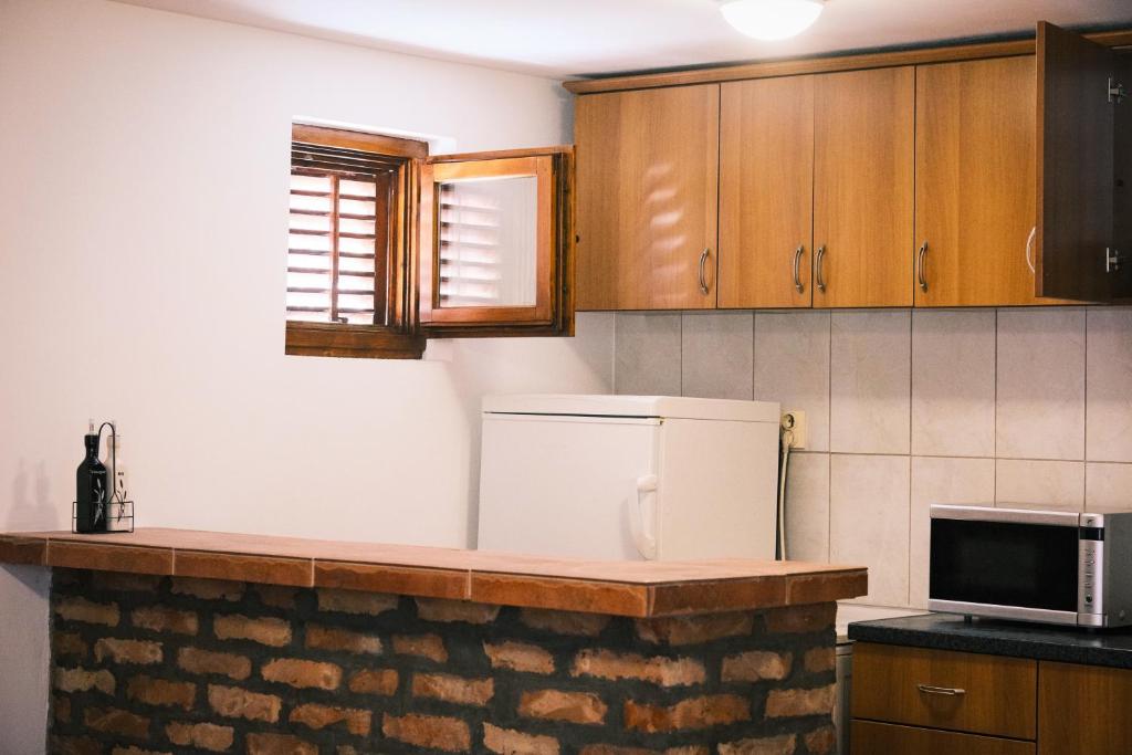 Kuchyň nebo kuchyňský kout v ubytování Cozy Place