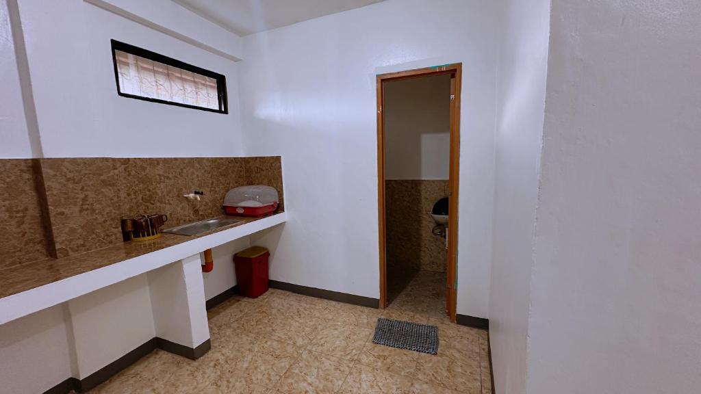 a bathroom with a sink and a toilet at Lucia Guesthouse in San Juan