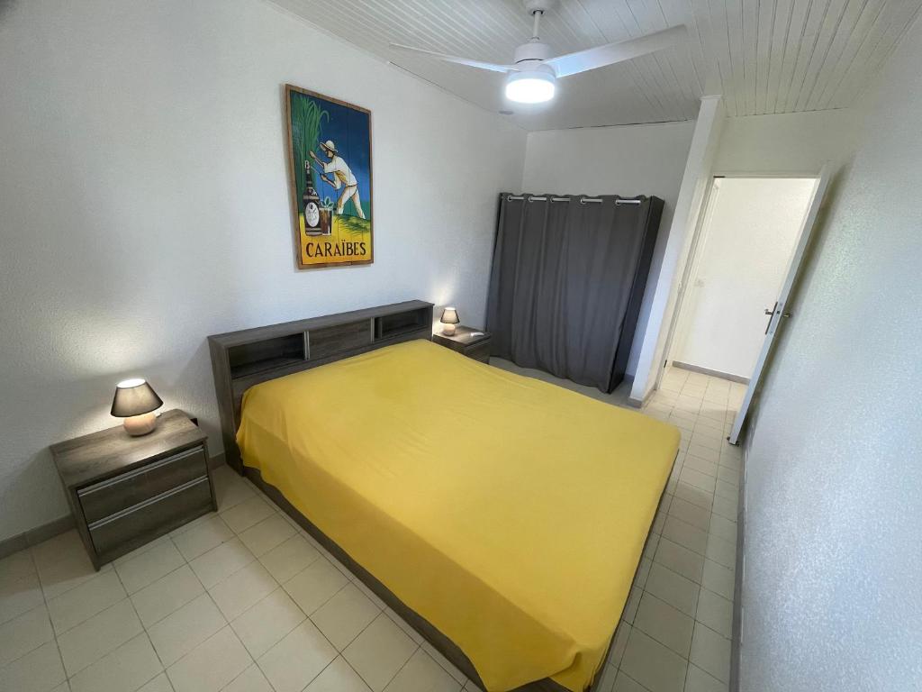 Postel nebo postele na pokoji v ubytování Villa Caraïbes