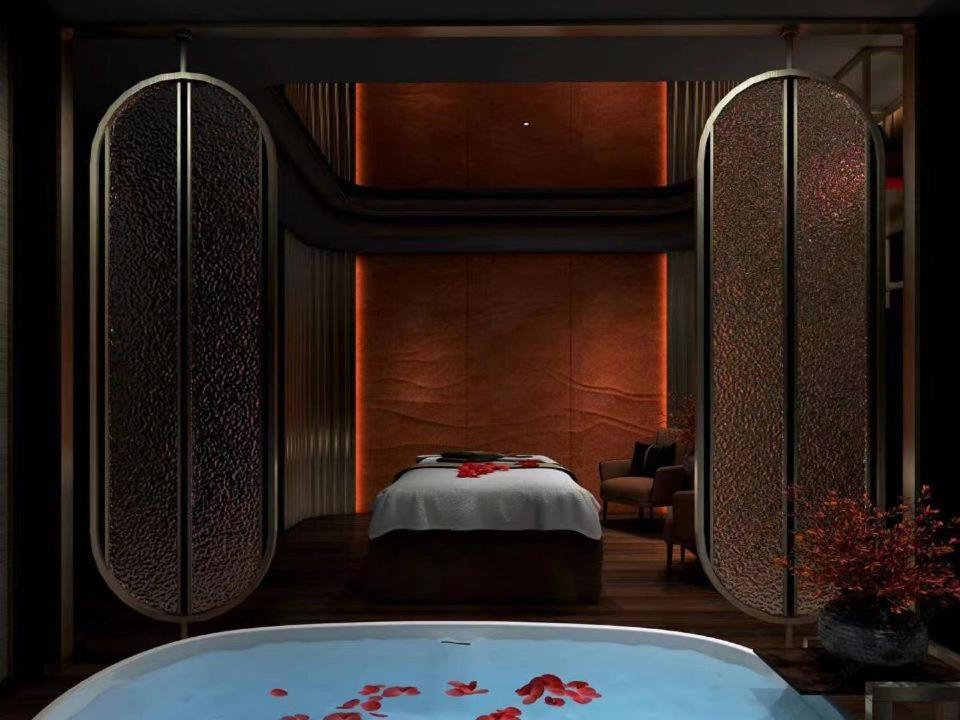 Postel nebo postele na pokoji v ubytování Eastern Casa Hotel Yiwu