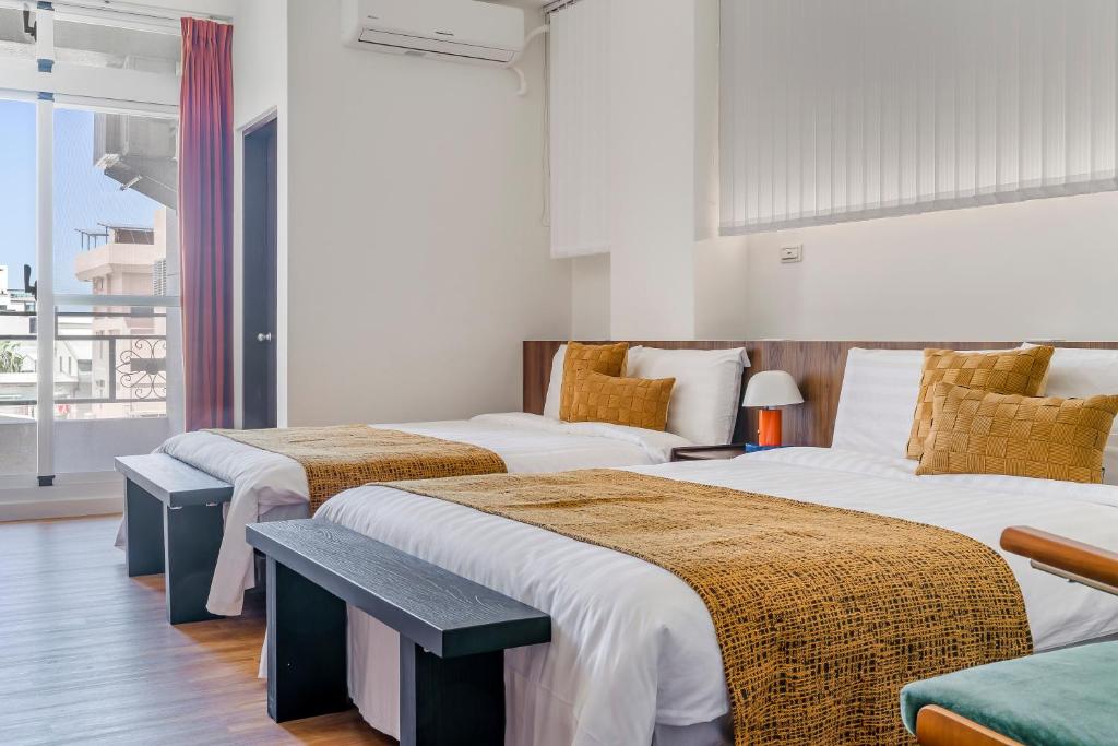 Postel nebo postele na pokoji v ubytování Oriental Blue Inn