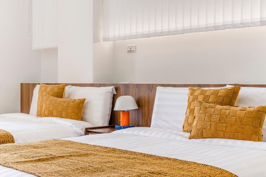 Postel nebo postele na pokoji v ubytování Oriental Blue Inn