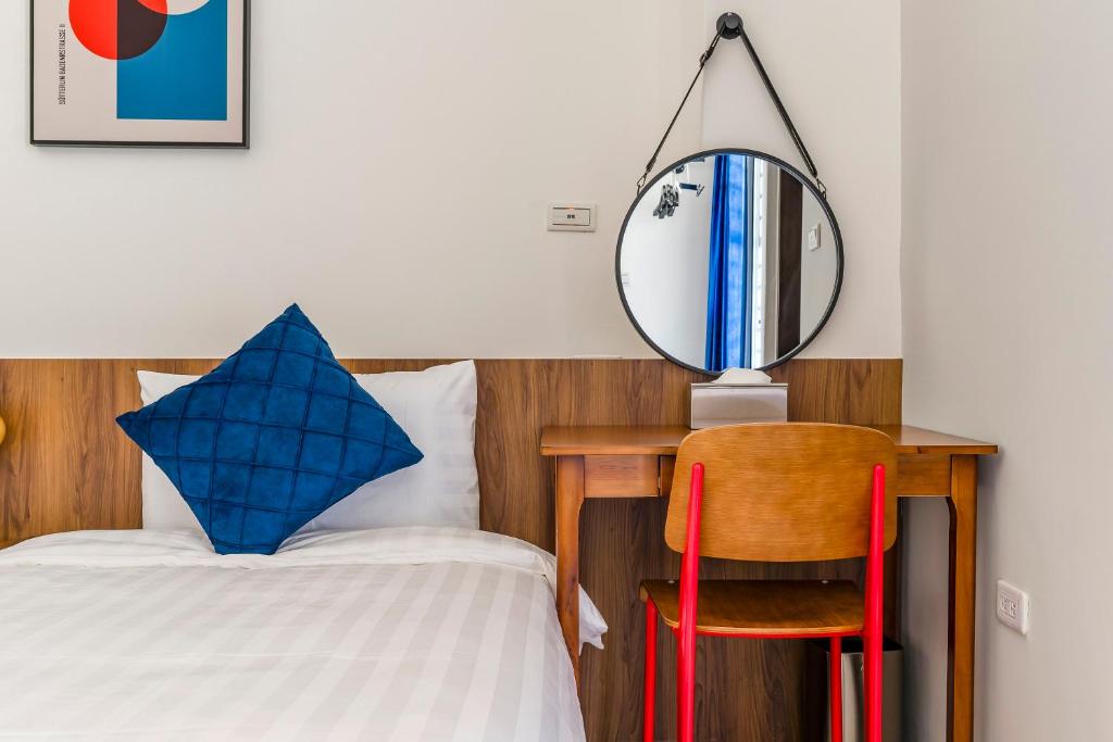 Postel nebo postele na pokoji v ubytování Oriental Blue Inn
