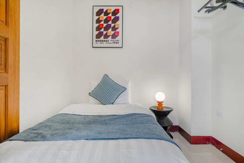 Postel nebo postele na pokoji v ubytování Oriental Blue Inn