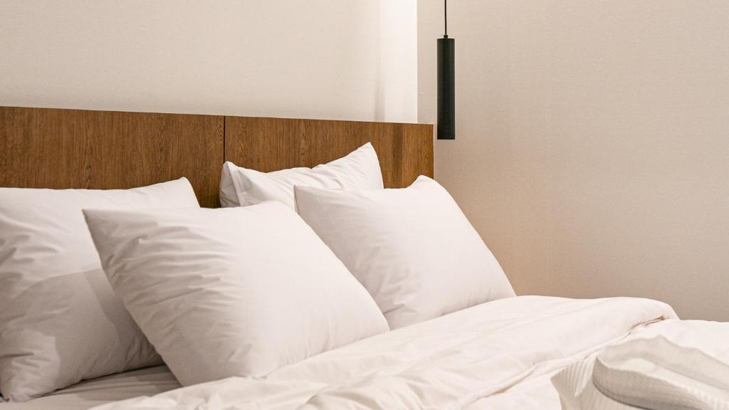 Postel nebo postele na pokoji v ubytování Hotel Yimok