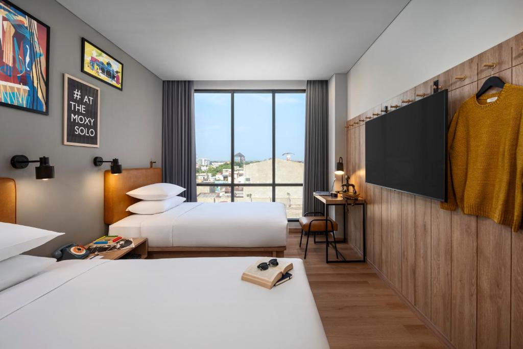 Letto o letti in una camera di Moxy Solo