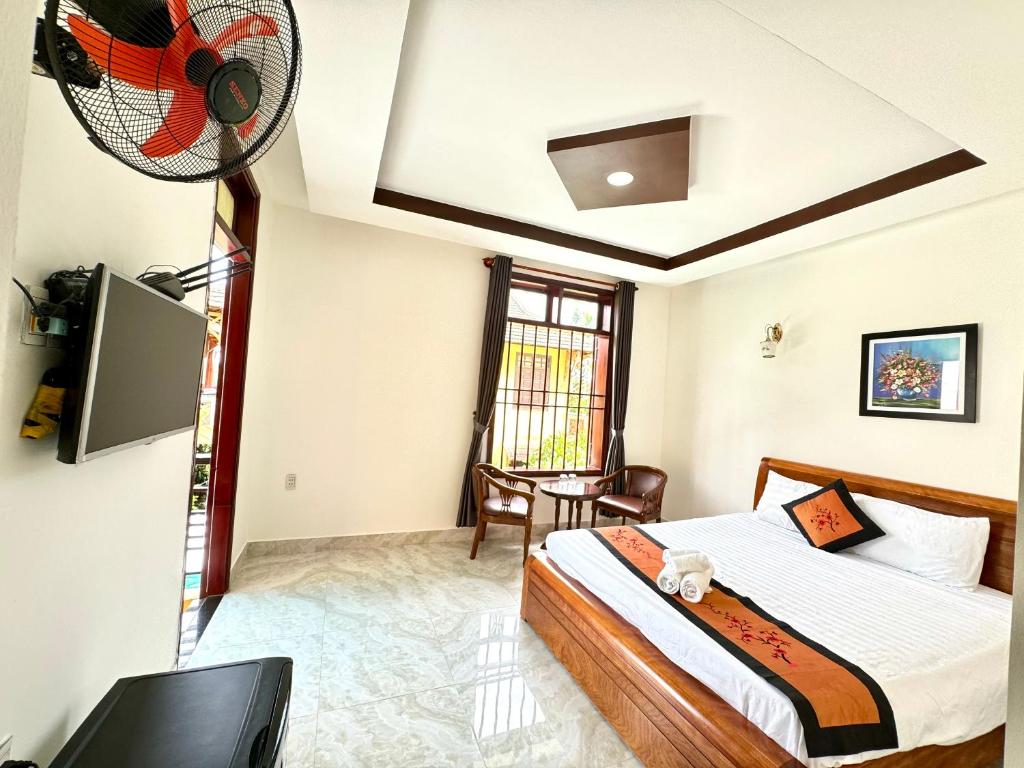 Postel nebo postele na pokoji v ubytování Hoi An Dat Cam Homestay