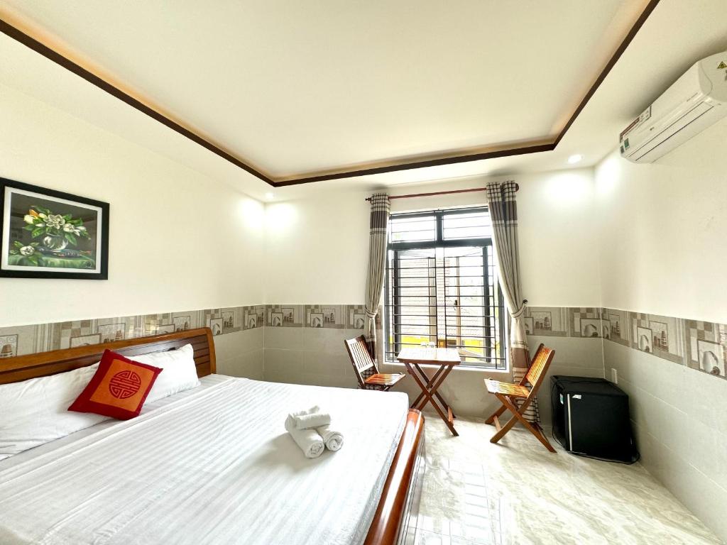 Postel nebo postele na pokoji v ubytování Hoi An Dat Cam Homestay