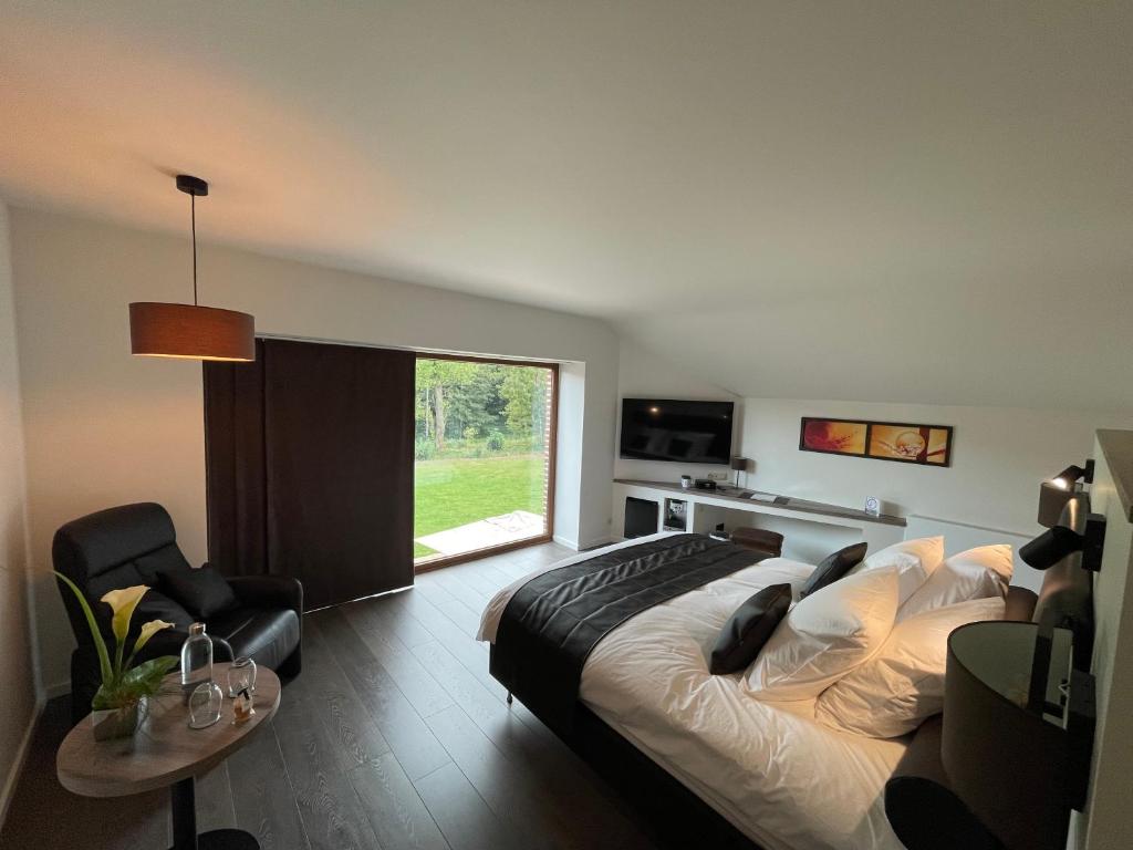 Postel nebo postele na pokoji v ubytování Domaine du Bois d'Hez - Corporate Privative Hotel
