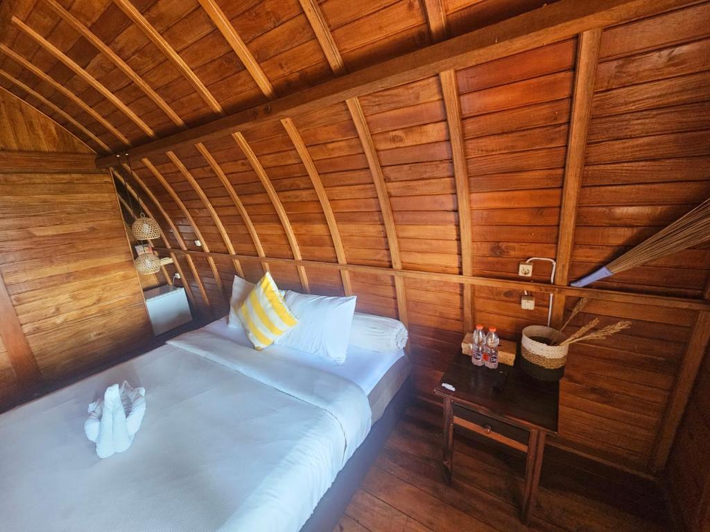 Postel nebo postele na pokoji v ubytování Lumbung Hill Bedugul