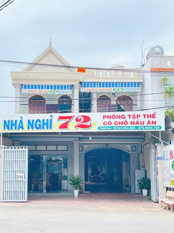 a building with a sign on the front of it at Nhà nghỉ 72 in Long Hai