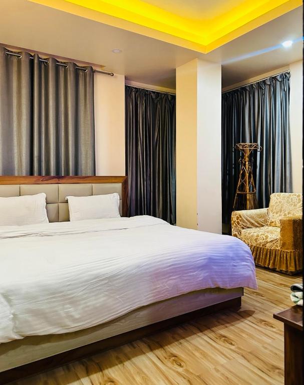 Postel nebo postele na pokoji v ubytování Hotel Balgopal