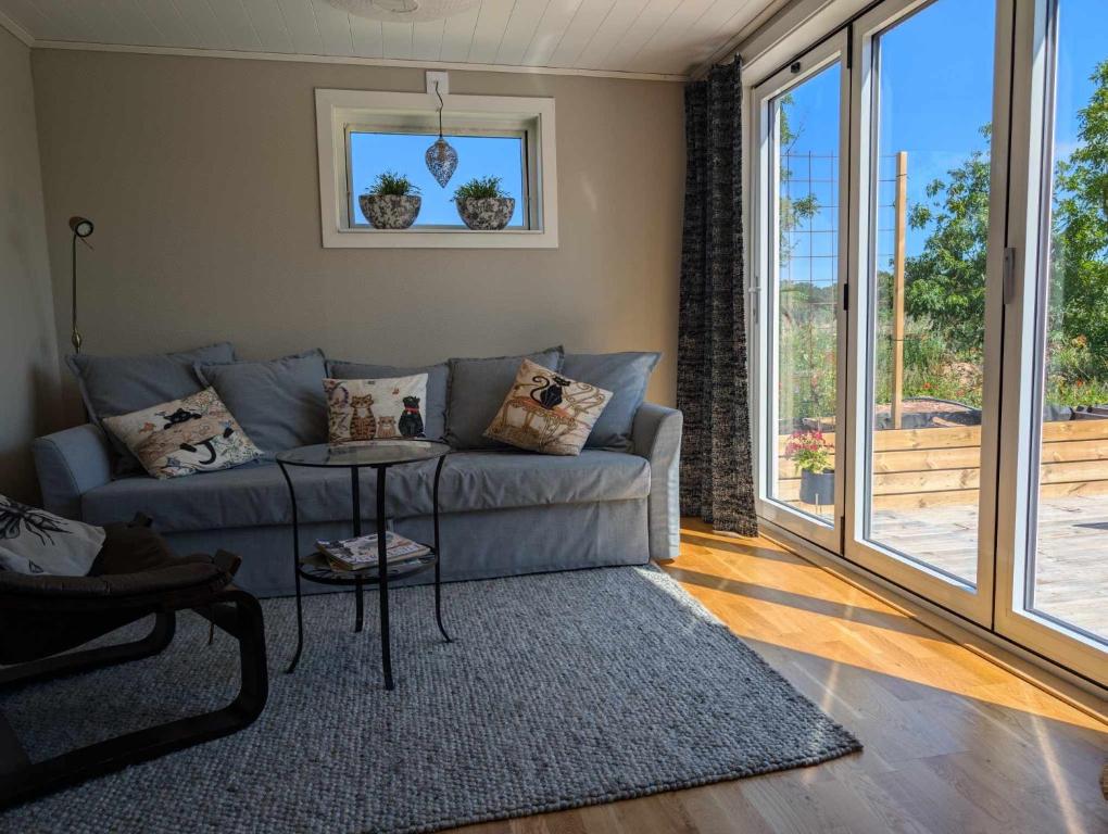 a living room with a couch and a table at Gunnabo in Borgholm