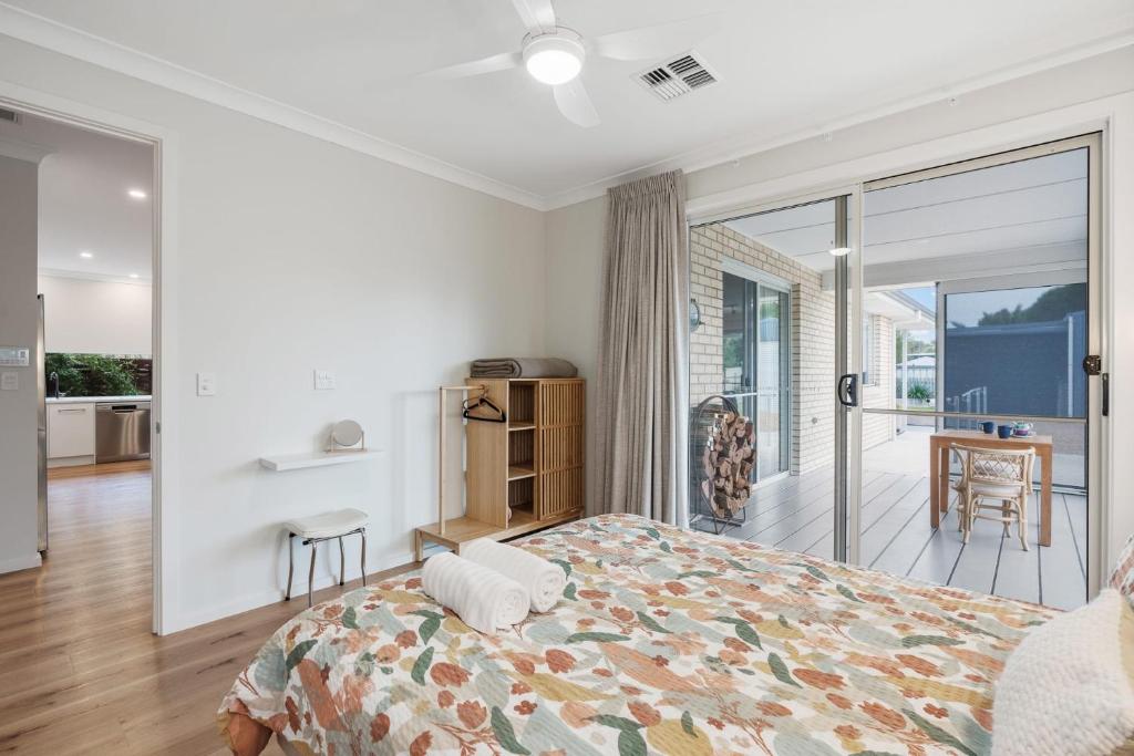 a bedroom with a bed and a balcony at Shepherds Delight-Access Friendly-Linen Included in Goolwa South