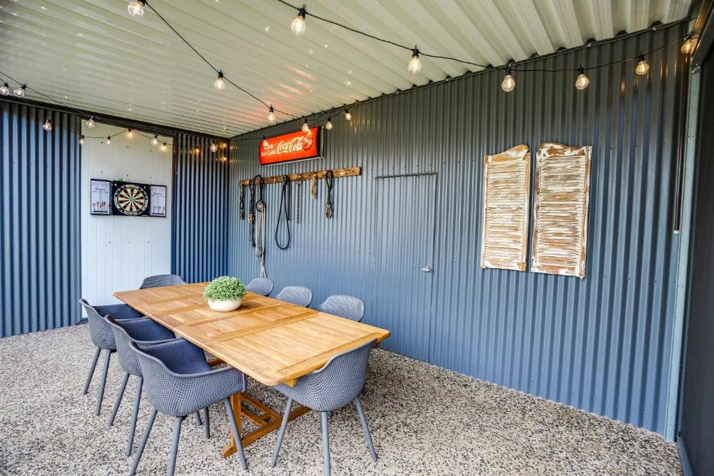 a dining room with a wooden table and chairs at Shepherds Delight-Access Friendly-Linen Included in Goolwa South