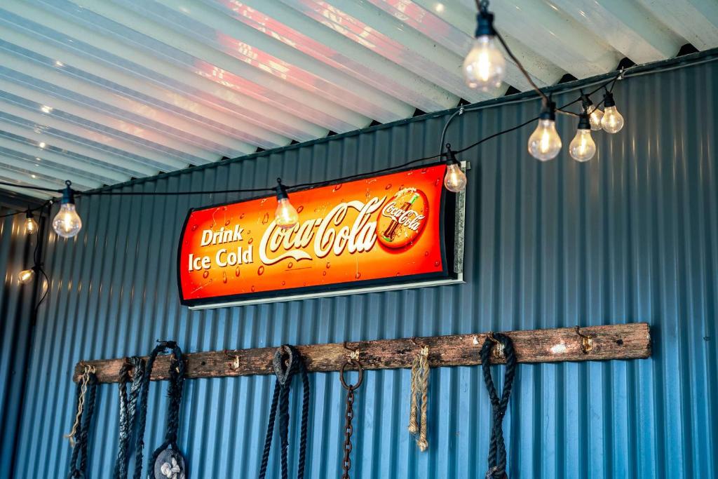 a sign on the wall of a building with lights at Shepherds Delight-Access Friendly-Linen Included in Goolwa South