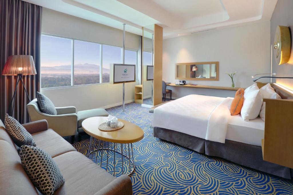 Katil atau katil-katil dalam bilik di Hotel Ciputra Cibubur managed by Swiss-Belhotel International