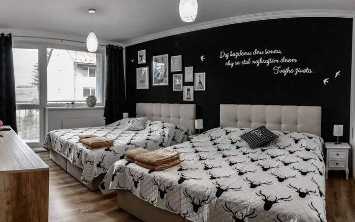 Ένα ή περισσότερα κρεβάτια σε δωμάτιο στο Style Apartment Telgárt