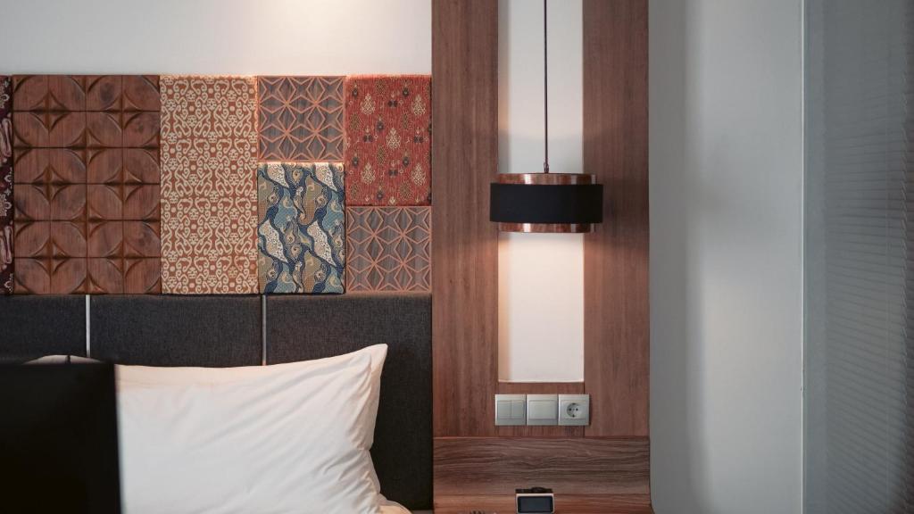 Postel nebo postele na pokoji v ubytování Fairfield by Marriott Bali South Kuta