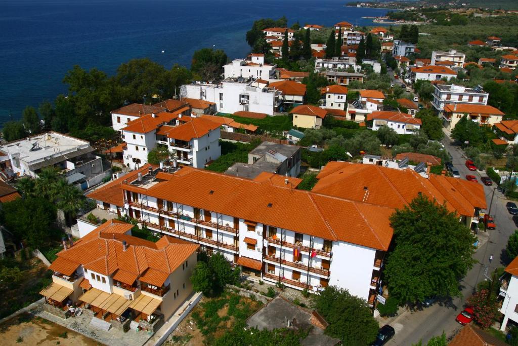 an aerial view of a town with orange roofs at IZEΛA Hotel in Kala Nera
