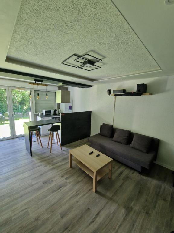Posezení v ubytování Logement Atypique & Parking GRATUIT