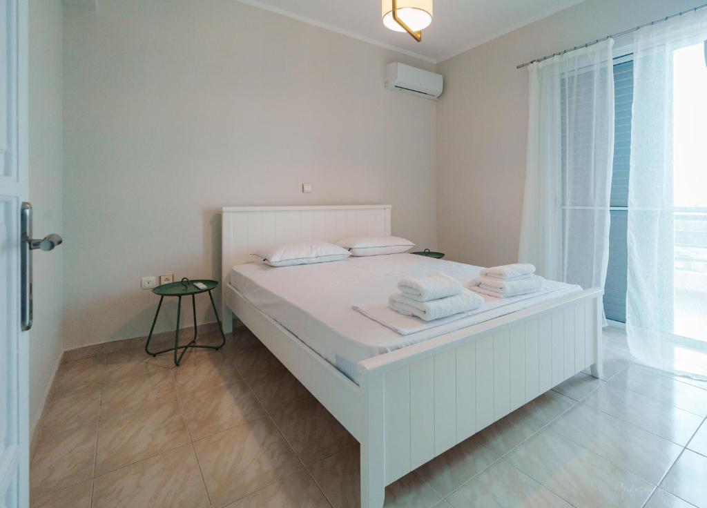 Postel nebo postele na pokoji v ubytování Pantokratoras View