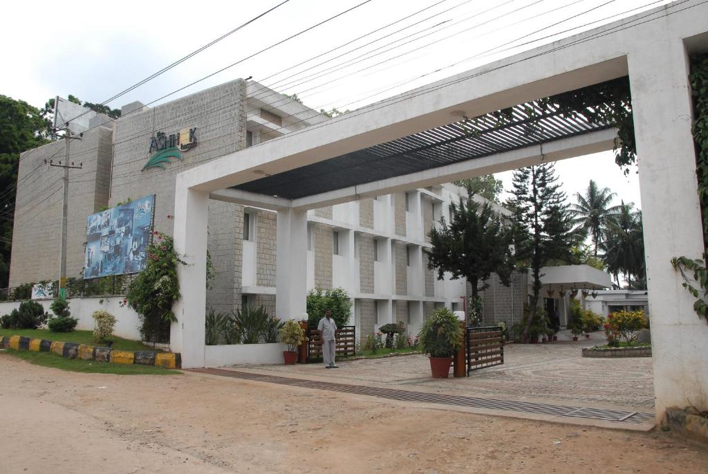 a building with an archway in front of it at Hassan Ashok in Hassan