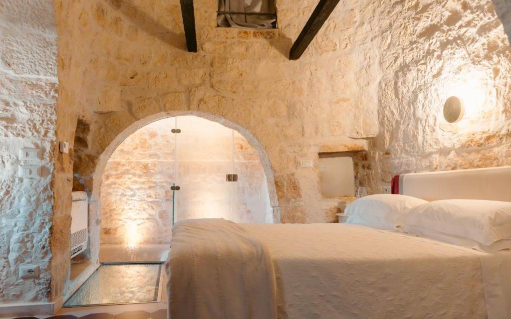 Posteľ alebo postele v izbe v ubytovaní Leonardo Trulli Resort