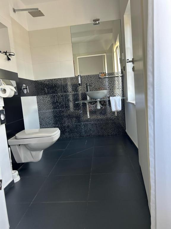 Kúpeľňa v ubytovaní Apartamenty M&M