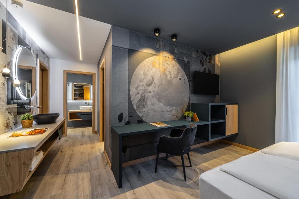 Postel nebo postele na pokoji v ubytování Hotel Paganella Andalo