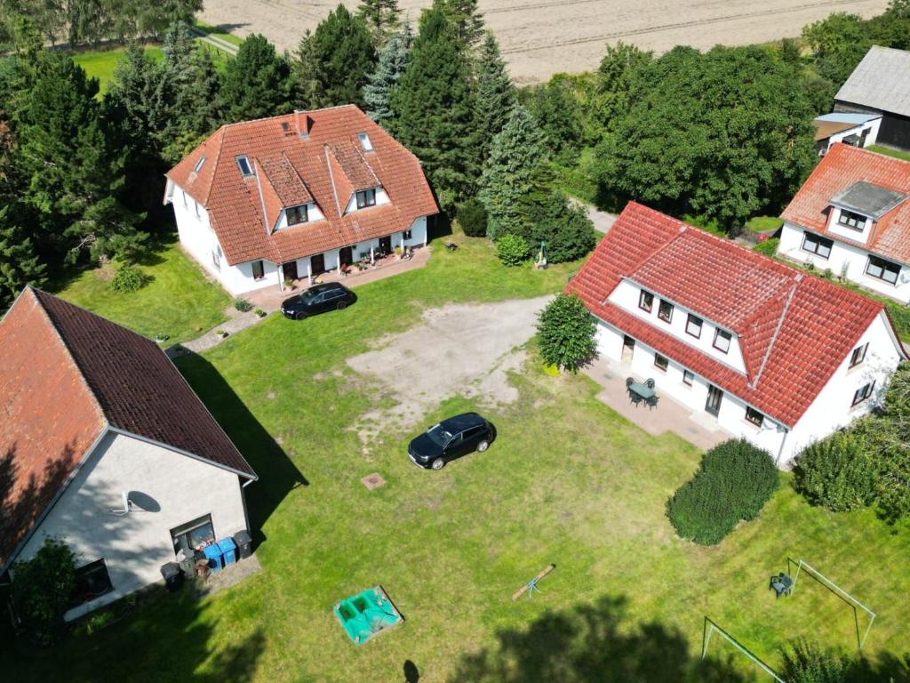 an aerial view of a house with two buildings at Ruegen_Fewo 155 in Veikvitz
