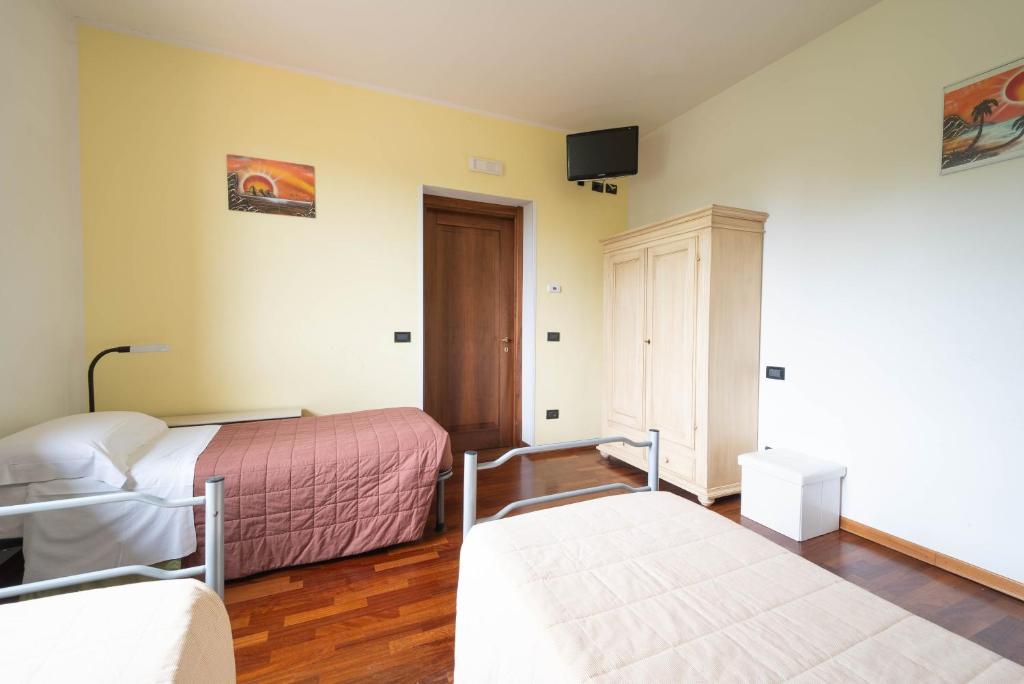 Postel nebo postele na pokoji v ubytování Agriturismo Bortolino