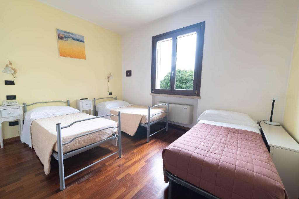 Postel nebo postele na pokoji v ubytování Agriturismo Bortolino