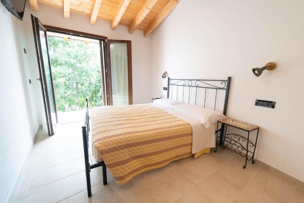 Postel nebo postele na pokoji v ubytování Agriturismo Bortolino