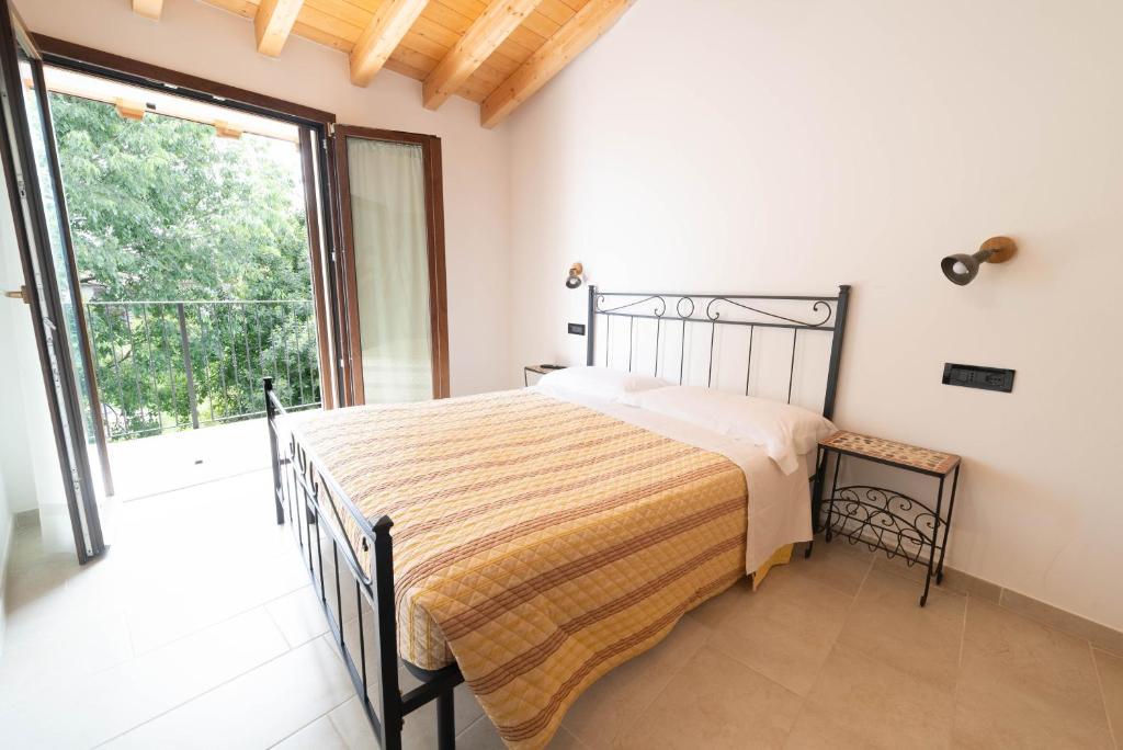 Postel nebo postele na pokoji v ubytování Agriturismo Bortolino