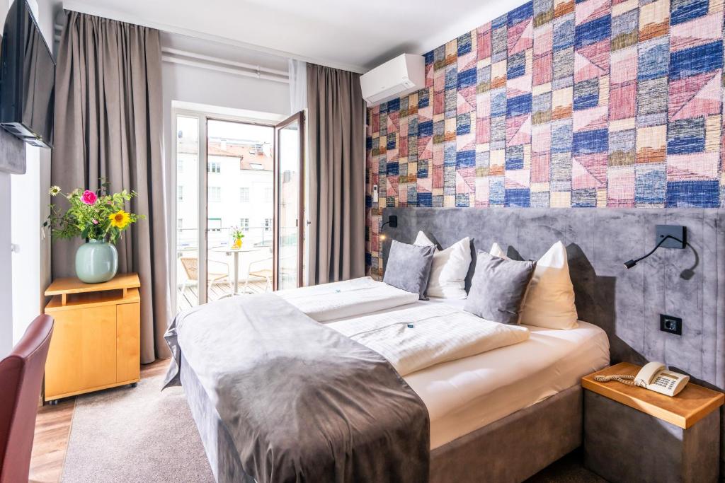 Cama o camas de una habitación en Gästehaus Klinglhuber