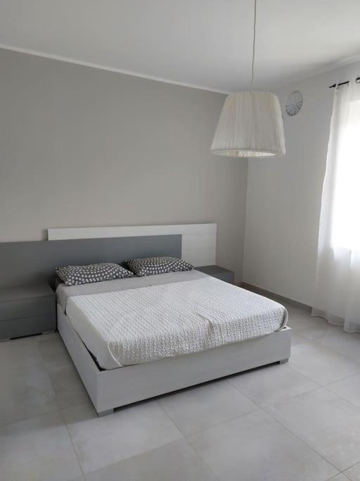 Ένα ή περισσότερα κρεβάτια σε δωμάτιο στο casa nonna mara